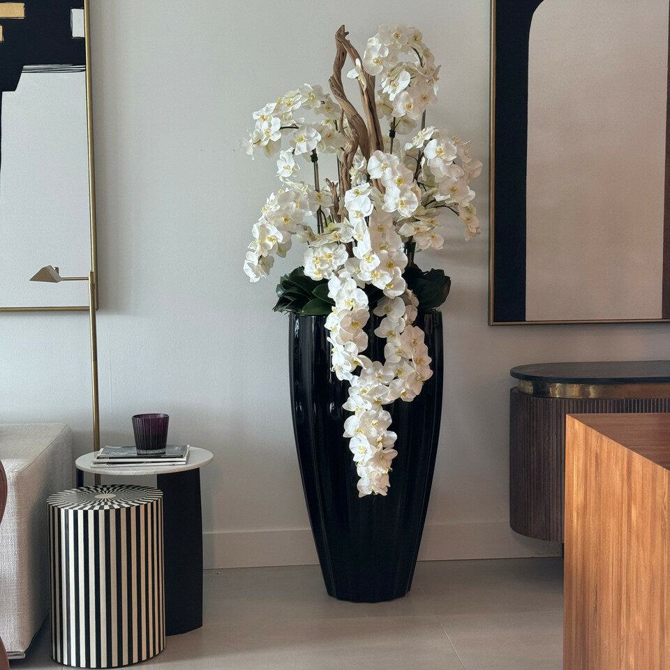 San Jose Vase in glossy black with hanging yellow orchids