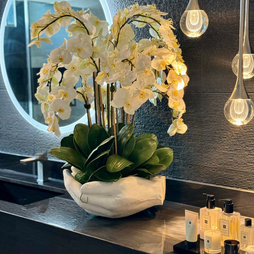 White Phalaenopsis Orchids in Open Hands Sculpture Pot